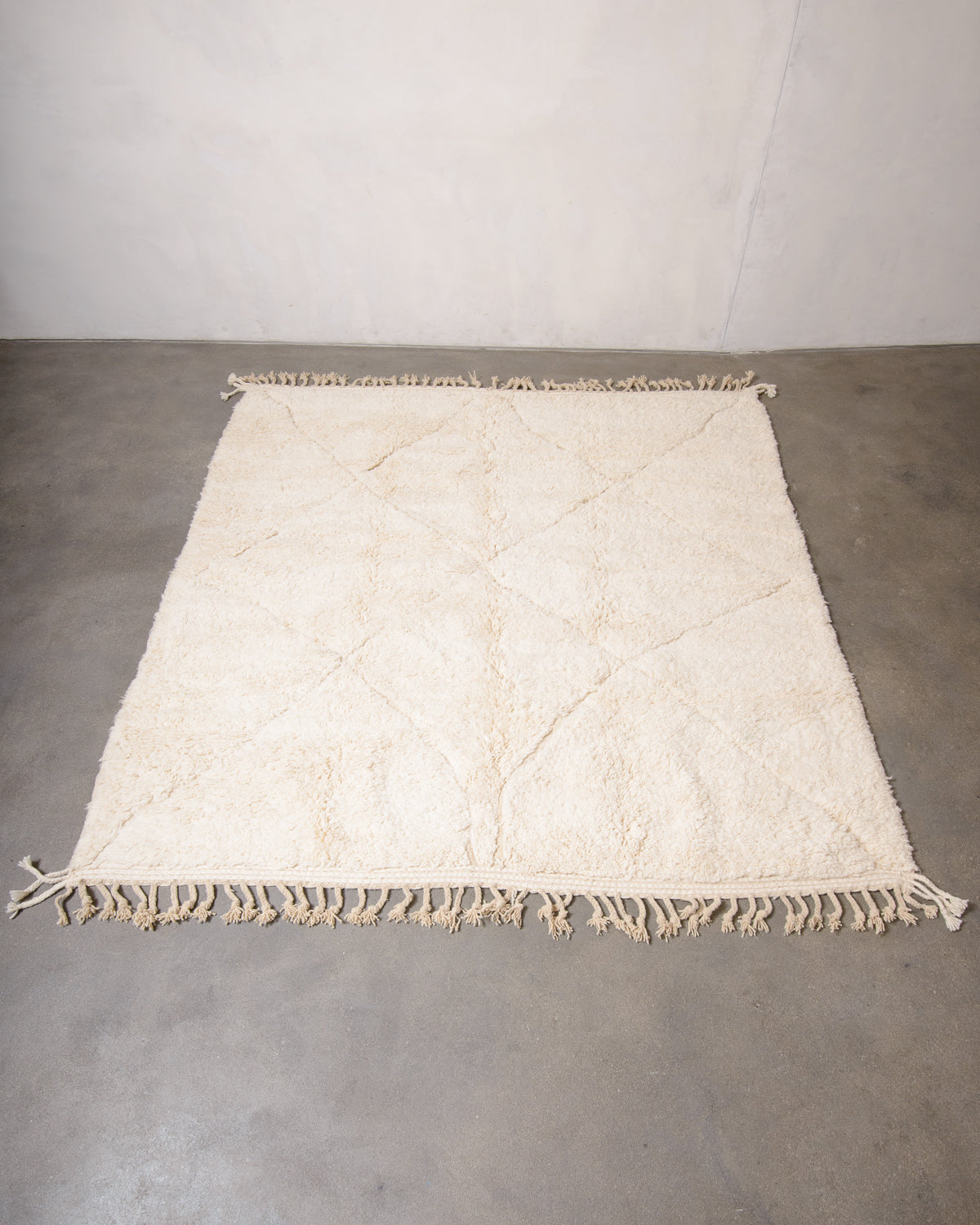 Modern, designer, handcrafted Berber rug from Morocco. Beniourain carpet with minimalist design, natural wool pile and a fluffy texture.